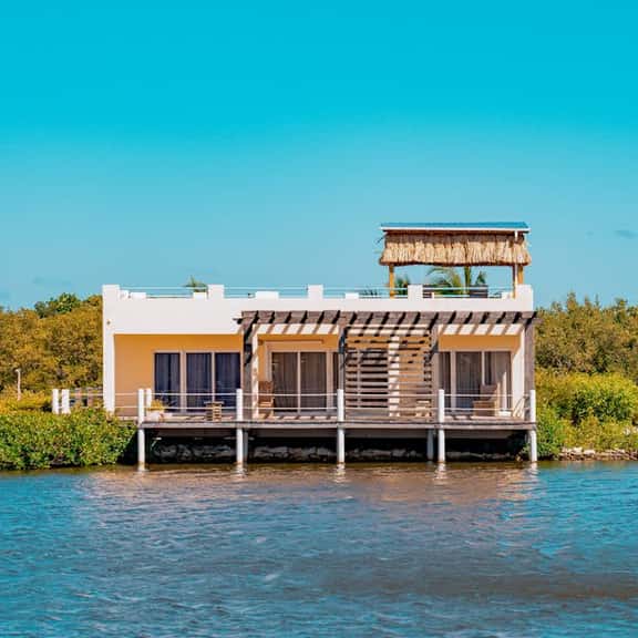 Cozy Waterfront Villa Home w Shared Pool, Water Views, WiFi, & AC - Walk to the Beach - Image 1
