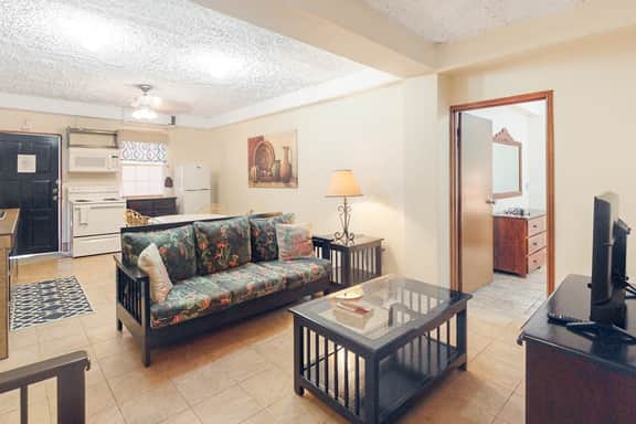 Homey suite in town w WiFi, partial AC, shared pool & veranda - walk to beach