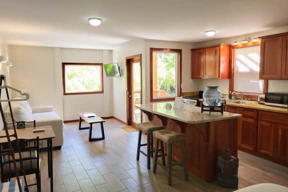 Scenic retreat on the beach with a balcony - pool, grill, dock, and canoe access