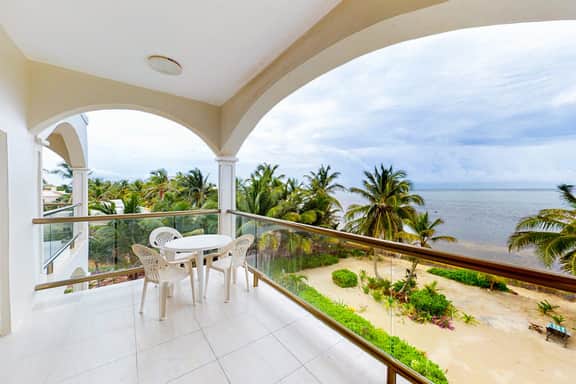 Beachfront condo with ocean views, WiFi, partial AC & shared pool, dock, kayaks
