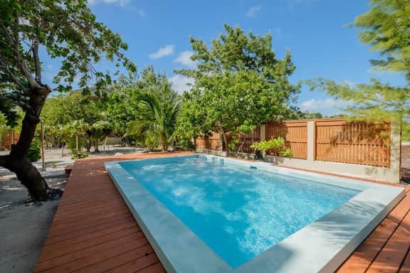 Beachfront abode with well-equipped kitchen - pool, beach, grill, & canoe access