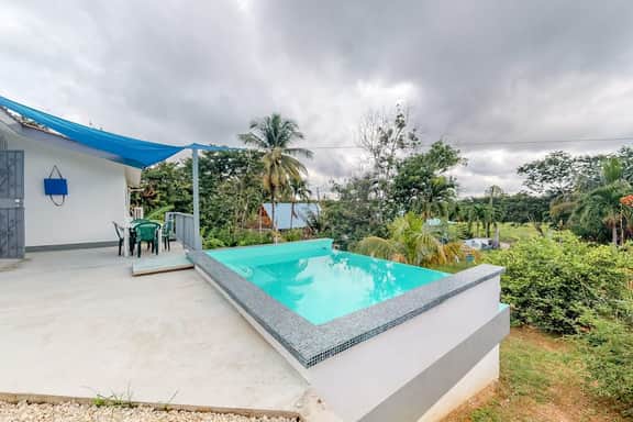 Welcoming home near town with private pool, jungle views, WiFi & partial AC