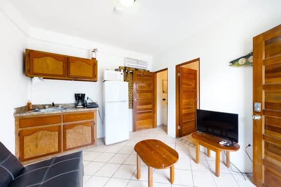 Multi-suite property w private pool, rooftop, grill, kayaks, partial AC & WiFi
