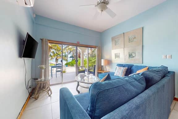 Ground-floor ocean-view condo with dock, pool, full kitchen, & AC