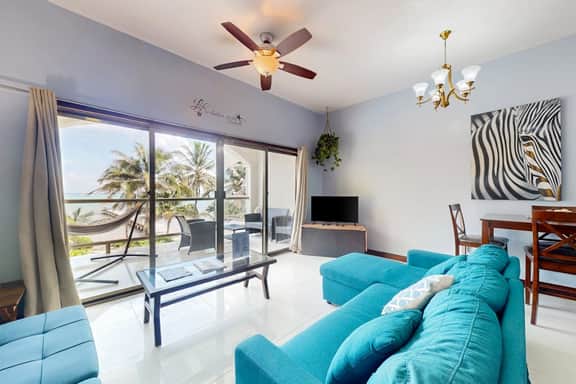Beachfront condo with balcony, sea view, partial AC, pool, dock & kayaks