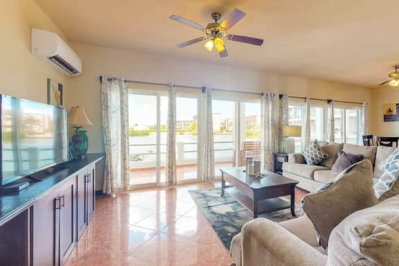 Beautiful lake-view villa with balcony, pool, & partial AC - near dining & shops