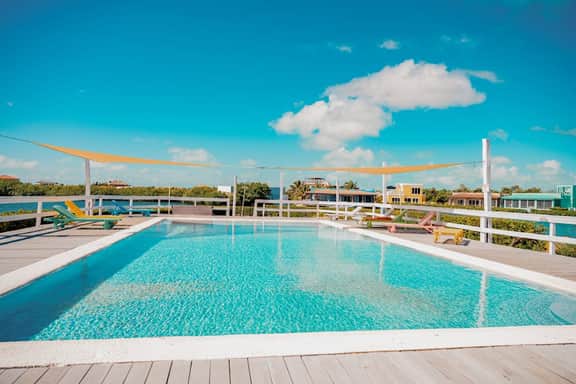 Beautiful lake-view villa with balcony, pool, & partial AC - near dining & shops