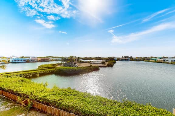 Comfortable condo with lagoon-view balcony, WiFi, AC & pool access