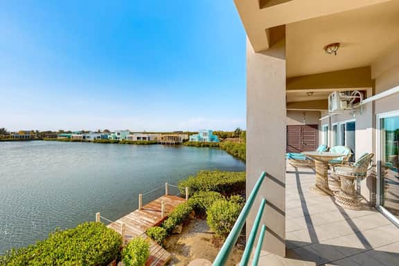 Comfortable condo with lagoon-view balcony, WiFi, AC & pool access