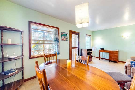Charming guesthouse with balcony, hammock, WiFi & partial AC - walk to the beach