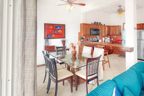 Stylish condo near the beach with pool, fast WiFi, partial ocean views & AC