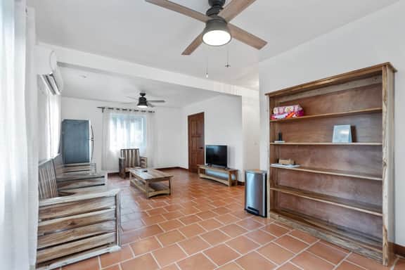 Beachfront home with dock, deck, hammocks, strong WiFi, AC & sea view