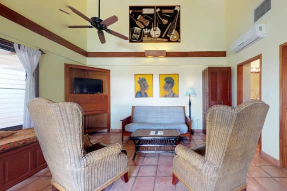 Oceanfront condo with shared pool, sea view, central AC & WiFi - walk to the beach