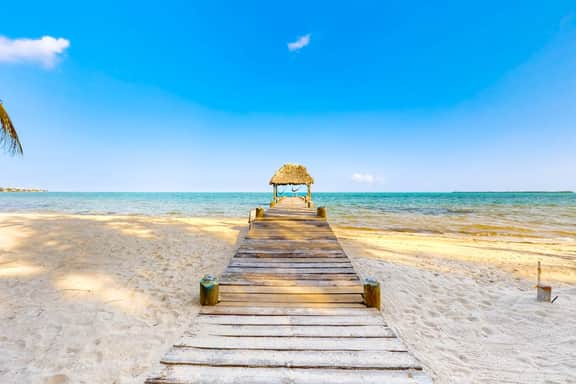 Romantic beachfront home with ocean views, dock, free WiFi, and outdoor dining