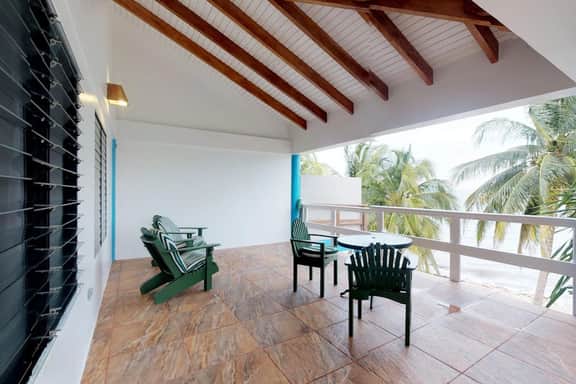Beachfront, ocean-view getaway with shared pool, hammock, WiFi, & central AC