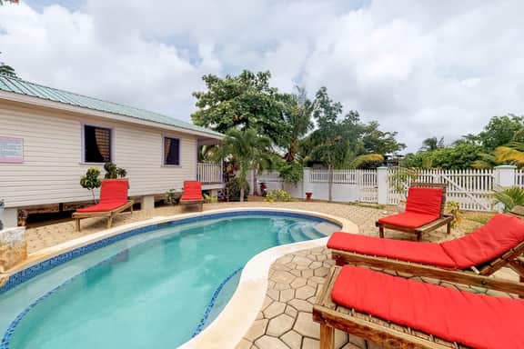 Charming cabana with a porch, hammock, strong WiFi, and a shared pool & grill