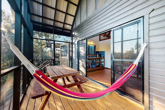 Romantic cabana with veranda, hammock, partial AC & WiFi - walk to the beach