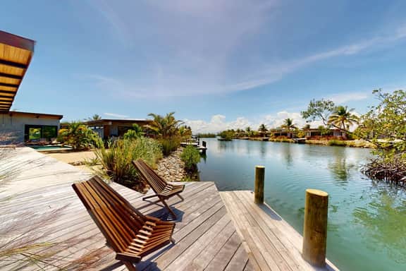 Elegant waterfront villa with private terrace, pool, beach access & 4 en-suites