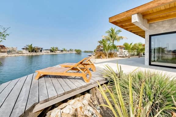 Tranquil waterfront villa with private deck & full kitchen