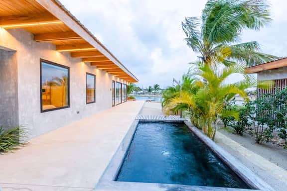 Waterfront villa with splash pool, private terrace, beach access & WiFi