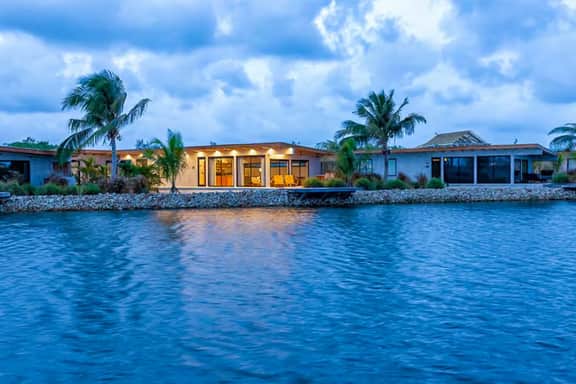 Waterfront villa with splash pool, private terrace, beach access & WiFi