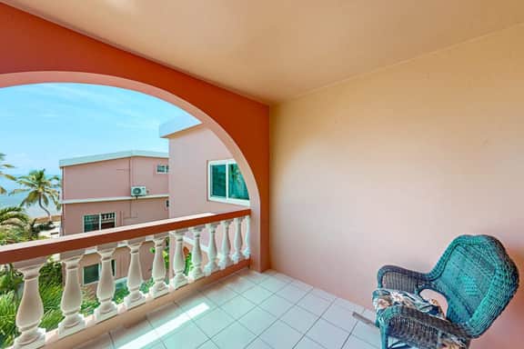 Two-story, ocean view condo w shared pool, two balconies, WiFi & partial AC