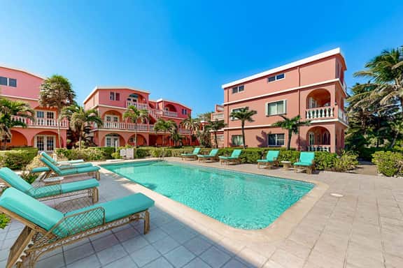 Ocean-view studio with pool, WiFi & partial AC - steps from the beach