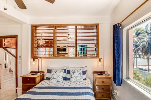 Beachfront condo with beach access, dock, pool, balcony, & ocean views