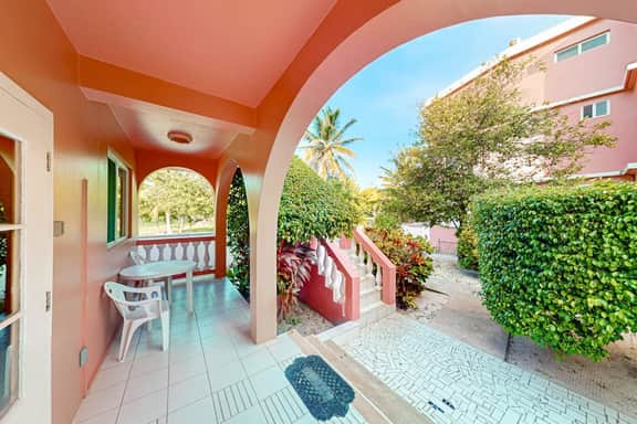 Garden-view condo steps to the beach with pool, dock & AC - snowbird-friendly