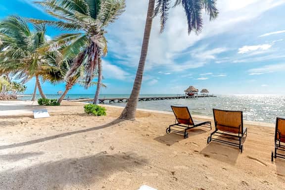 Ocean-view condo with outdoor pool, dock, grill, balcony, beach access