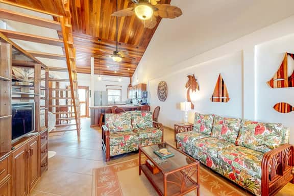 Family-friendly beachfront condo w shared pool & dock, sea view, WiFi & partial AC