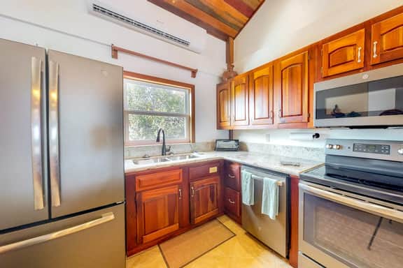 Family-friendly beachfront condo w shared pool & dock, sea view, WiFi & partial AC