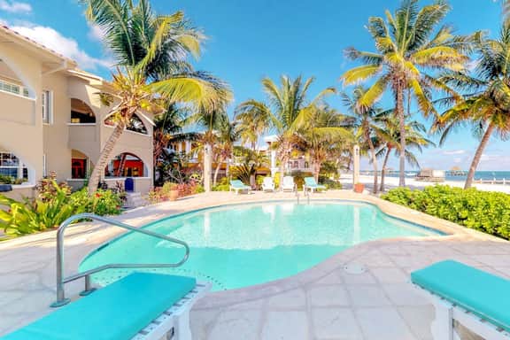Family-friendly beachfront condo w shared pool & dock, sea view, WiFi & partial AC