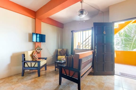 Family-friendly condo with WiFi & partial AC, located just steps from the ocean