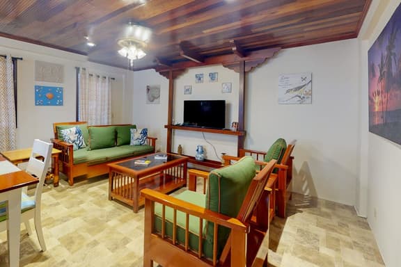 Air-conditioned suite with WiFi and a shared pool & terrace - walk to the beach