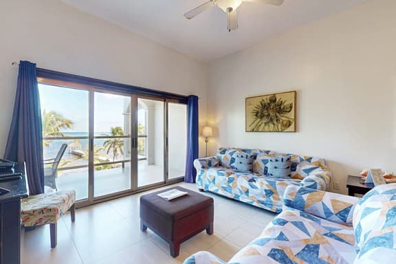 Serene oceanfront condo with shared pool, ocean view, WiFi, & partial AC