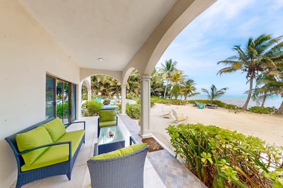Ground-floor ocean-view condo with dock, pool, full kitchen, & AC