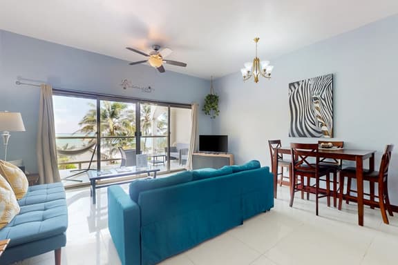 Beachfront condo with balcony, sea view, partial AC, pool, dock & kayaks