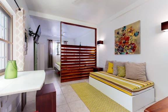 Tropical studio w patio, WiFi, AC - steps to the sea, water taxis & restaurants