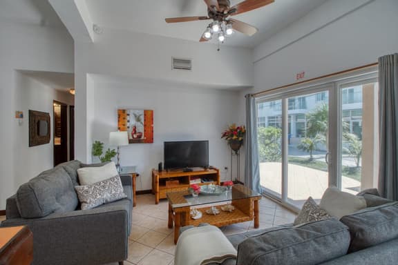 Ground-level condo w WiFi, central AC, & pool - walk to the beach