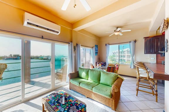 Comfortable condo with lagoon-view balcony, WiFi, AC & pool access