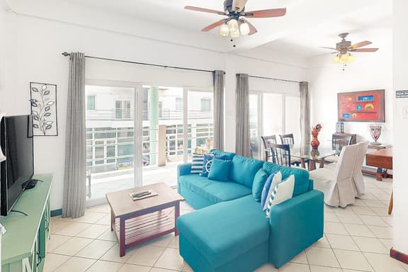 Stylish condo near the beach with pool, fast WiFi, partial ocean views & AC