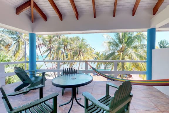 Oceanfront condo with shared pool, sea view, central AC & WiFi - walk to the beach