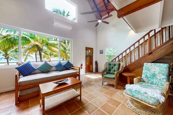 Romantic beachfront home w ocean views, dock, hammock, veranda & free WiFi