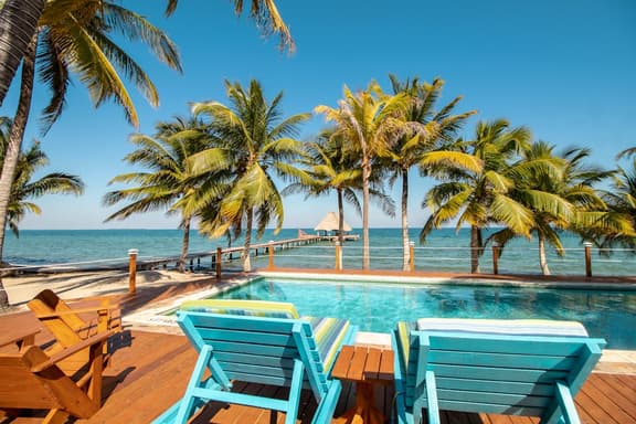 Beachfront, ocean-view getaway with shared pool, hammock, WiFi, & central AC