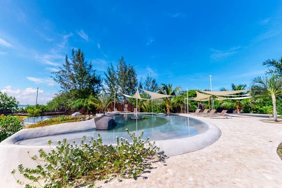 Lagoon view retreat villa with pool, private hot tub, & AC
