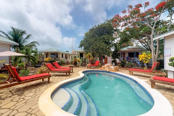 Cabana with WiFi and a shared pool, patio area, and grill - walk to the beach