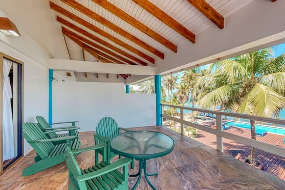 Ocean view condo at beachfront complex with AC, free WiFi, & pool