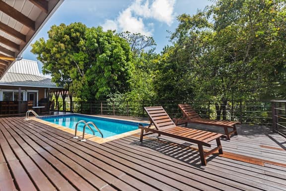 Tropical beachfront getaway with private pool, ocean views & enclosed yard