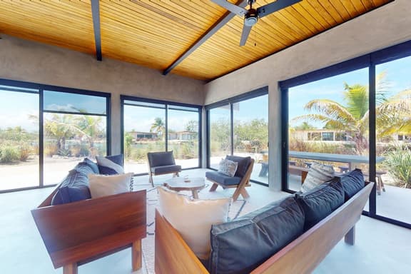 Elegant waterfront villa with private terrace, pool, beach access & 4 en-suites